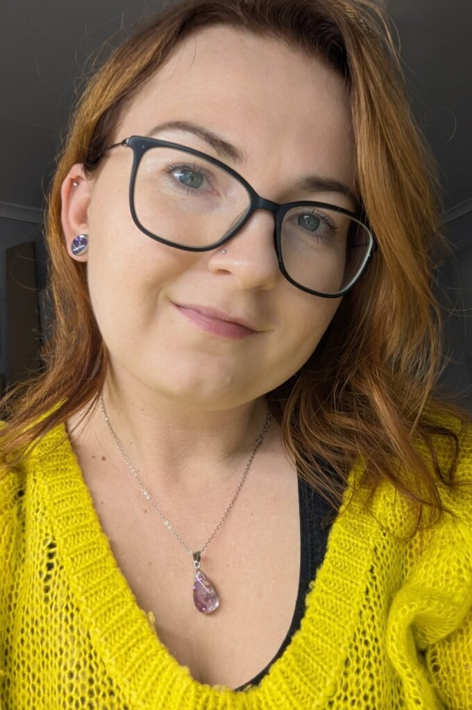 beautiful woman with glasses, wearing handmade jewellery necklace